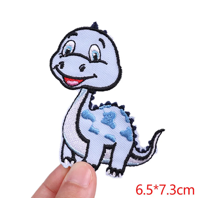 Small dinosaur patch held by a hand with dimensions displayed