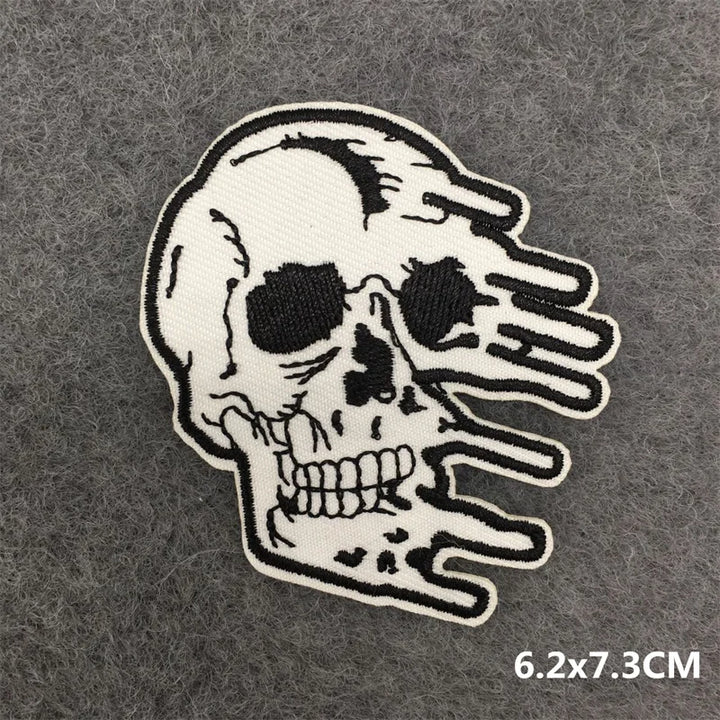 Skull hand patch on a gray background with size 6.2x7.3CM.