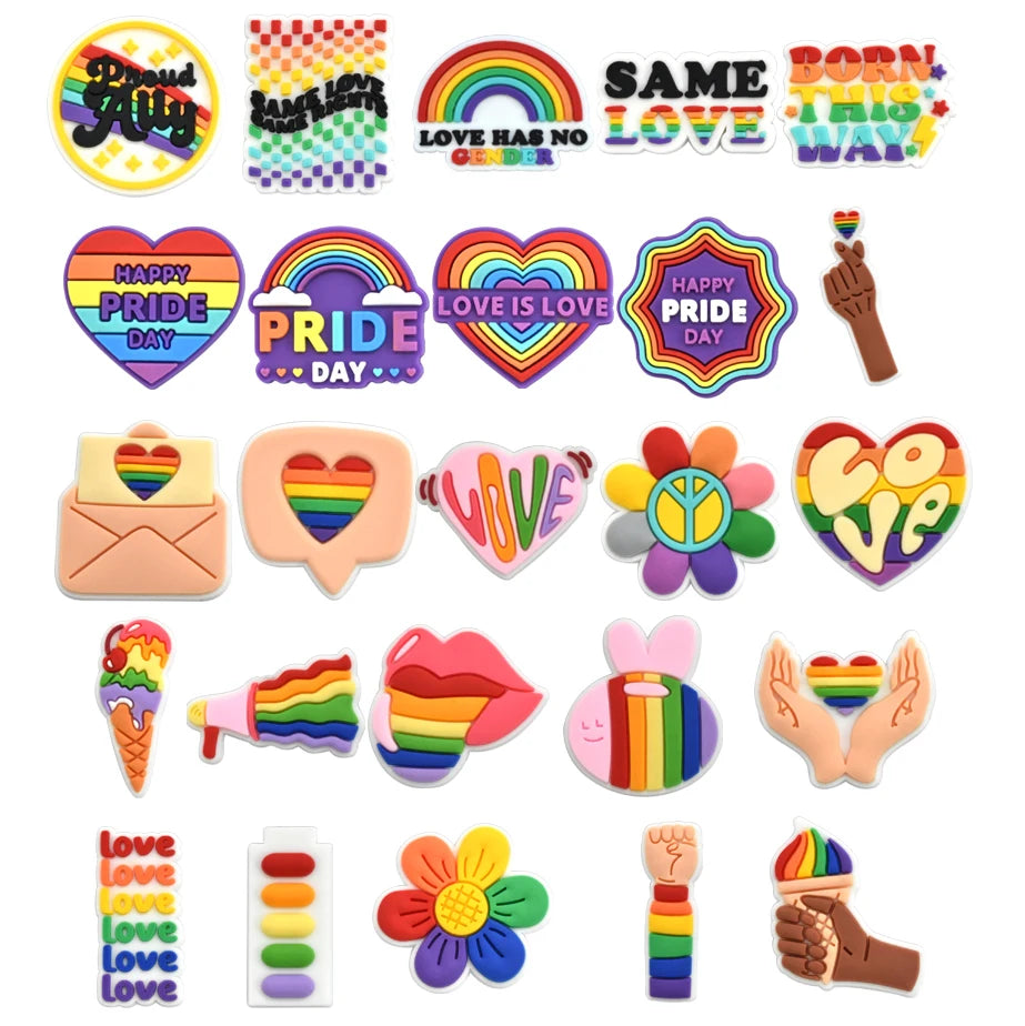 Collection of colorful Pride-themed shoe charms on a white background