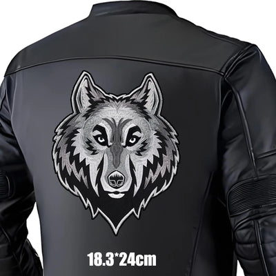Black leather jacket with a wolf design on the back, size indicated.