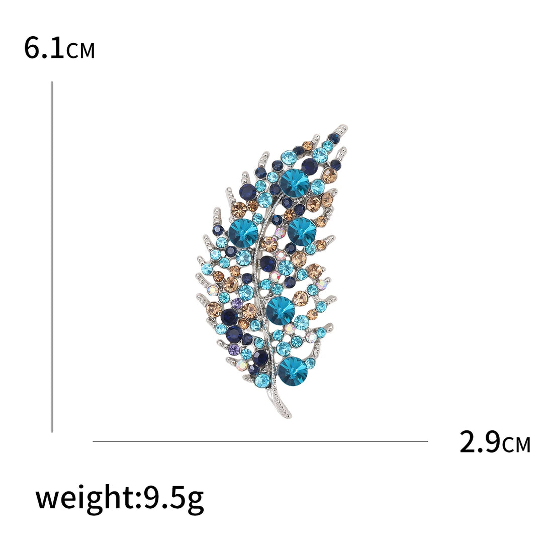 Jewelry brooch with gemstones on a white background