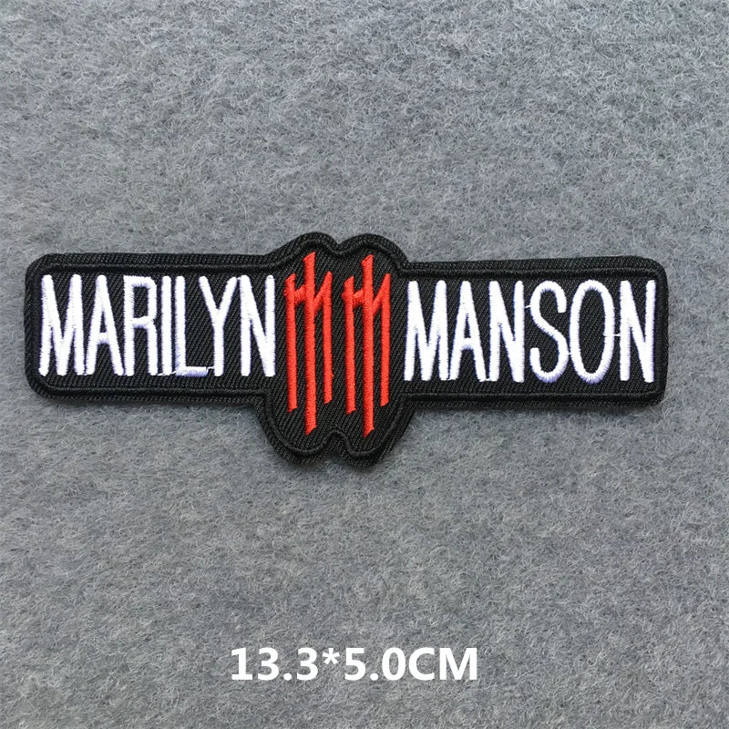 Marilyn Manson logo patch on a gray background with dimensions.