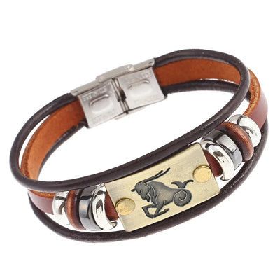 Bracelet with leather strap and metal accents featuring a zodiac symbol on a white background