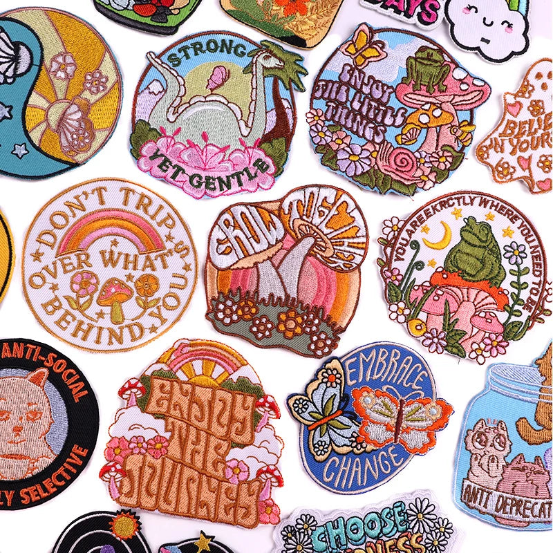 Collection of colorful embroidered patches with various designs and text.