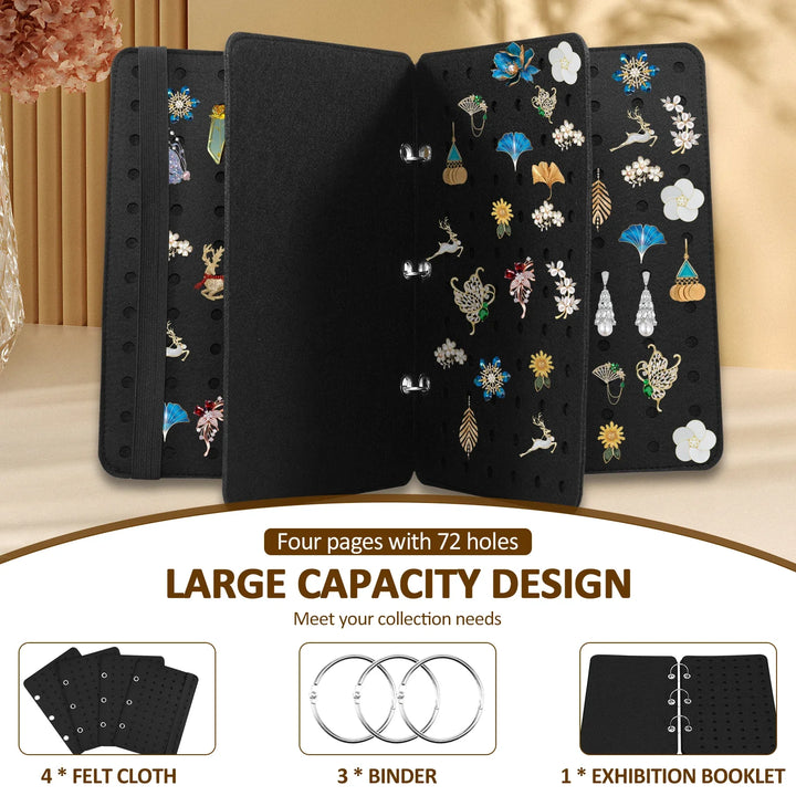 Black jewelry display folder with various brooches on a beige background