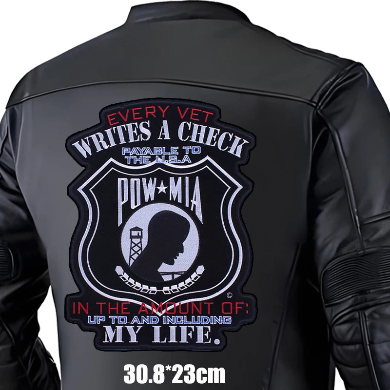 Black leather jacket with a POW/MIA patch on the back