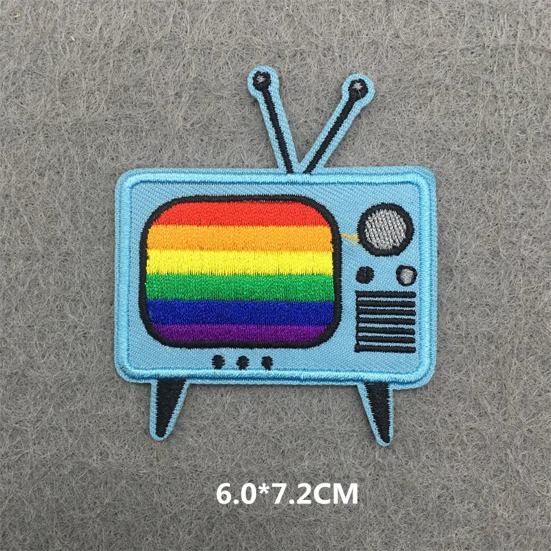 Patch of a retro television with a rainbow display on a gray background