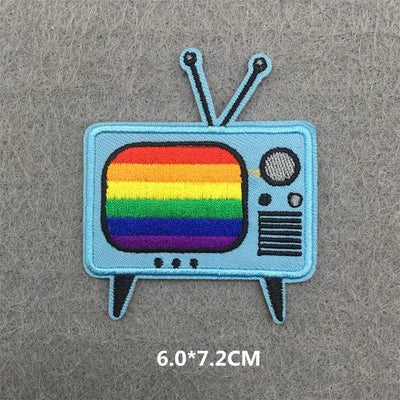 Patch of a retro television with a rainbow display on a gray background