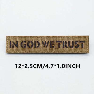 Textile patch with 'IN GOD WE TRUST' on a white background