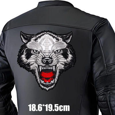 Black leather jacket with a wolf head design on the back, size indicated.