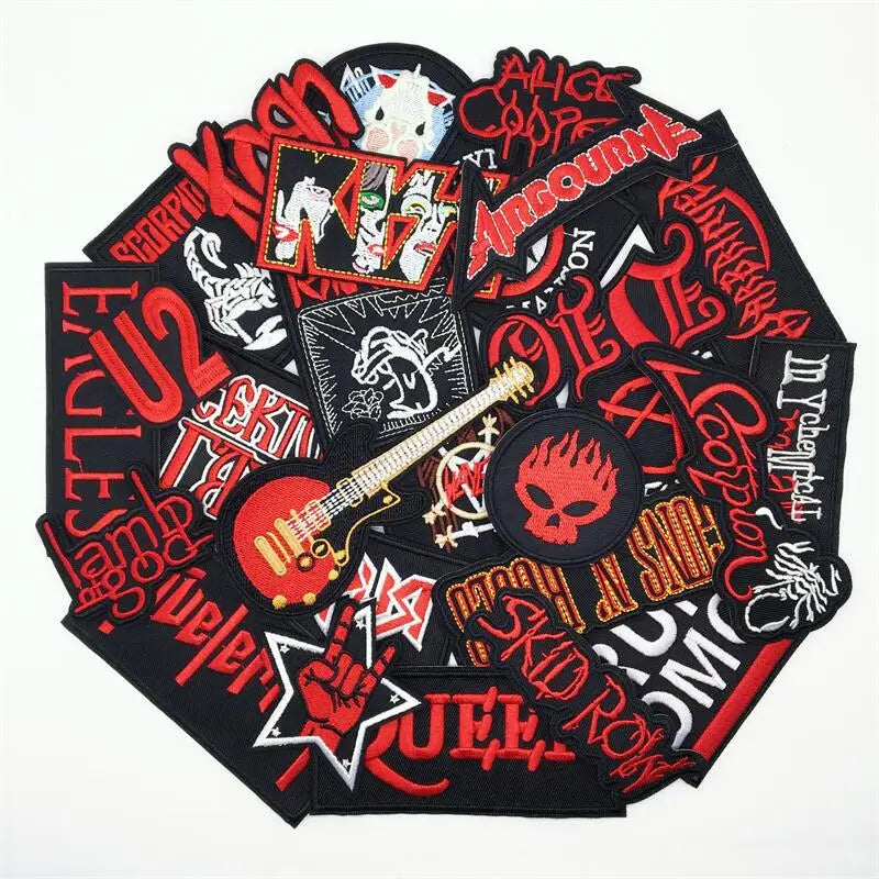 Collection of rock and roll-themed patches with various designs and text on a white background.