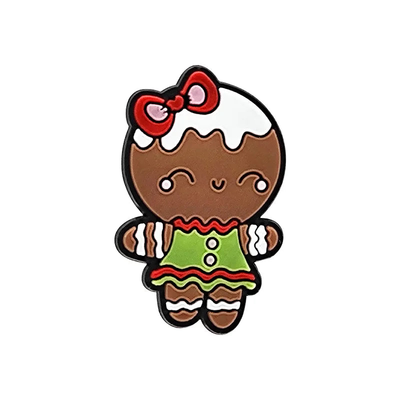 Shoe charm ornament of Gingerbread girl character with a red bow on a white background