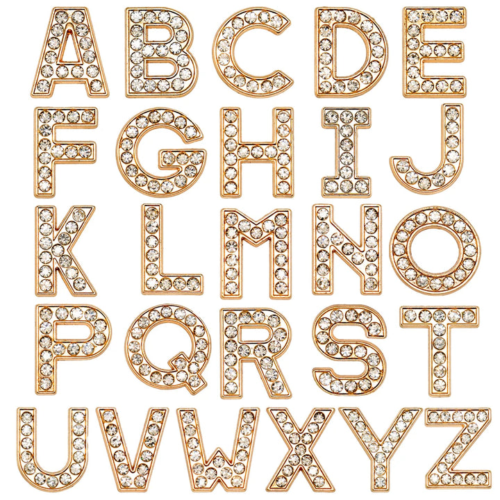 Gold letters shoe charms with rhinestones on a white background