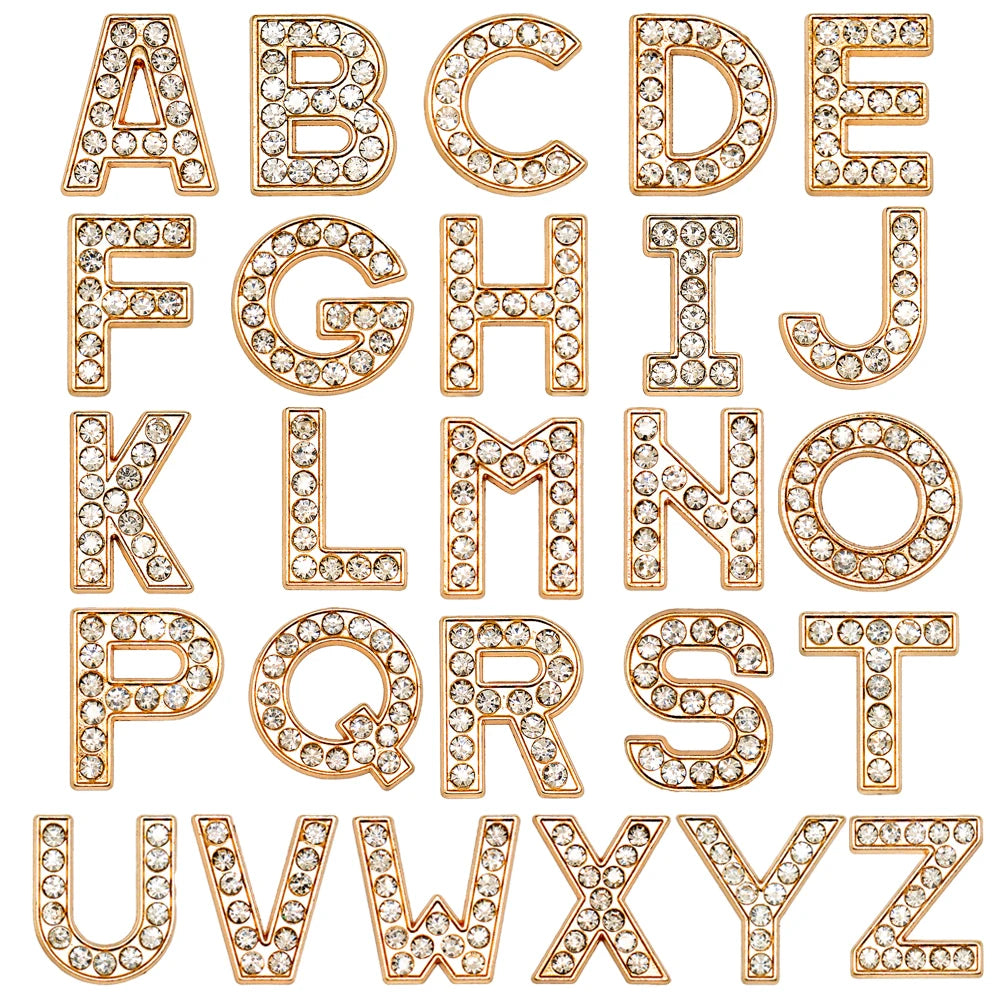 Gold letters shoe charms with rhinestones on a white background
