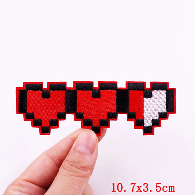 Pixelated heart with a thumbs down symbol held by a hand on a white background