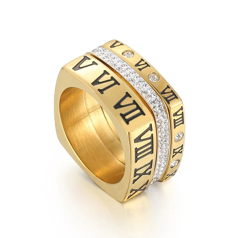 Gold ring with Roman numeral design on a white background
