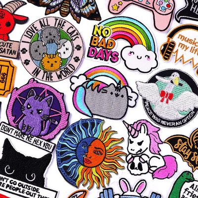 Collection of various colorful patches with different designs on a white background