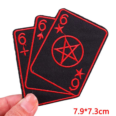 Three black patches with red symbols resembling playing cards held by a hand, with size '7.9*7.3cm' displayed.