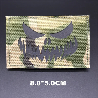 Camouflage patch with a skull design on a dark background