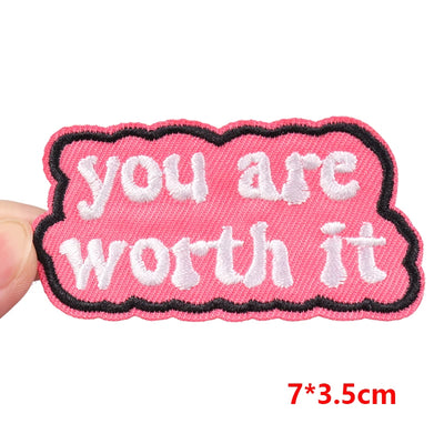 Pink patch with 'you are worth it' text held by a hand, size 7*3.5cm