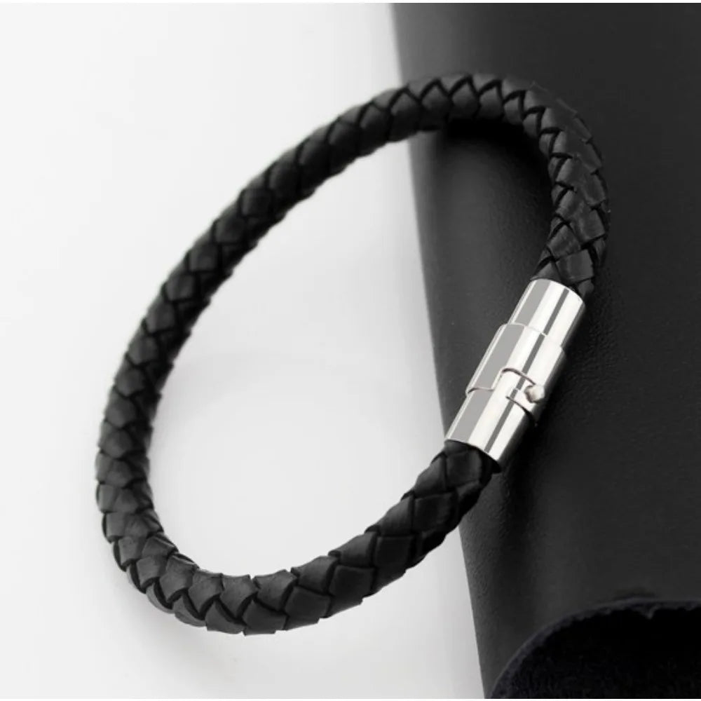 Black braided leather bracelet with a silver clasp on a white background