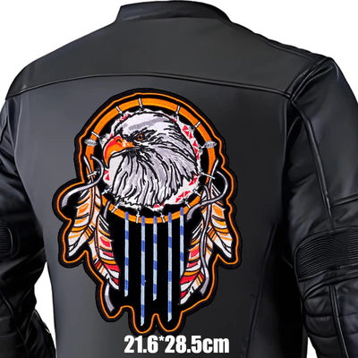 Black leather jacket with an eagle and dreamcatcher design on the back, on a white background.