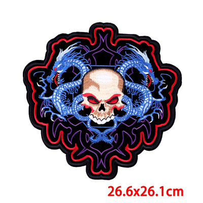 Decorative patch with skull and dragon design on a white background