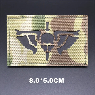 Multicam patch with skull design on a dark background