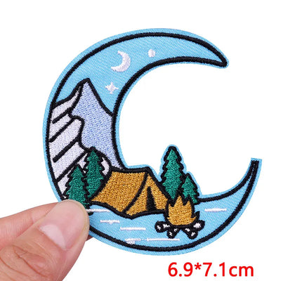 Patch with camping design held by a hand, showing size 6.9*7.1cm.