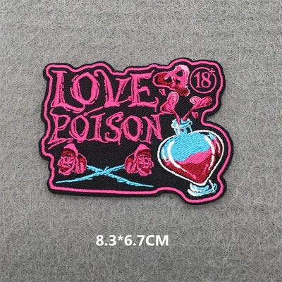 Embroidered patch with 'Love Poison' design on a gray background