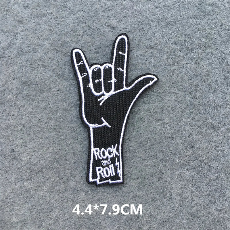 Hand-shaped 'Rock and Roll' patch on a gray background
