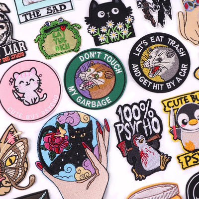 Collection of various colorful patches with different designs on a white background