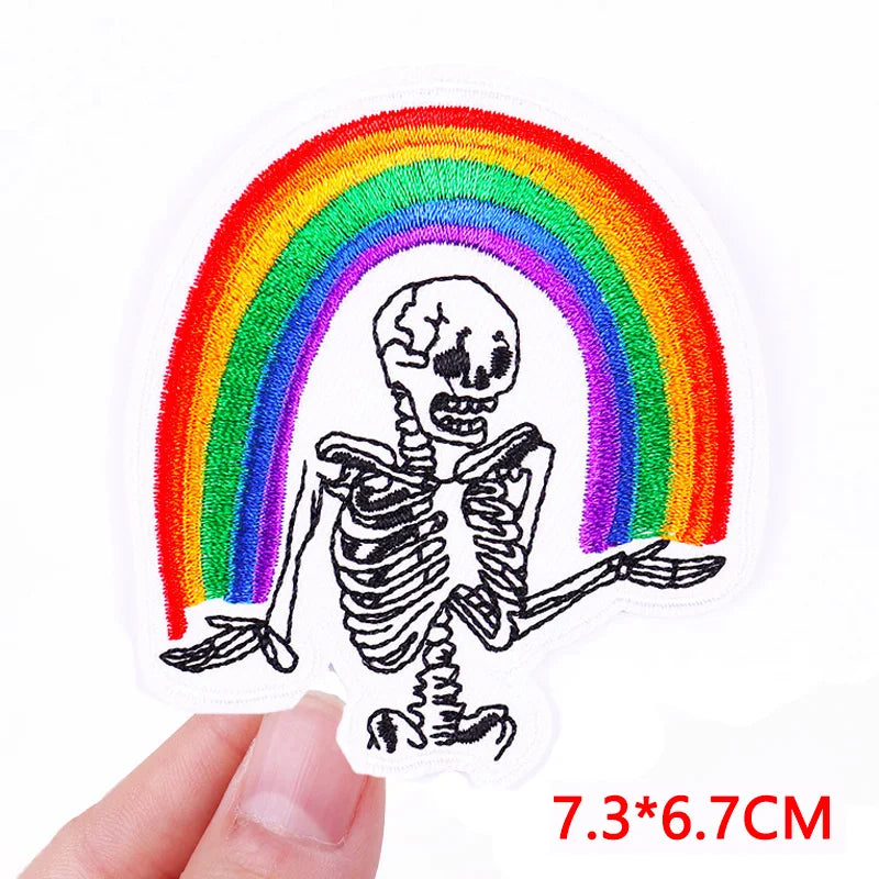 Skeleton with rainbow patch held by a hand, size 7.3*6.7CM