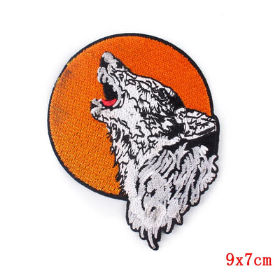Wolf patch with an orange circle background on a white background