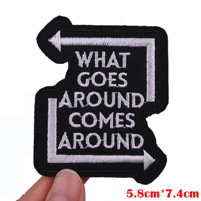 Embroidered patch with 'What goes around comes around' text on a white background