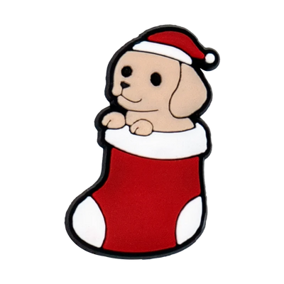 shoe charm of a Cartoon dog in a Santa hat and red stocking on a white background