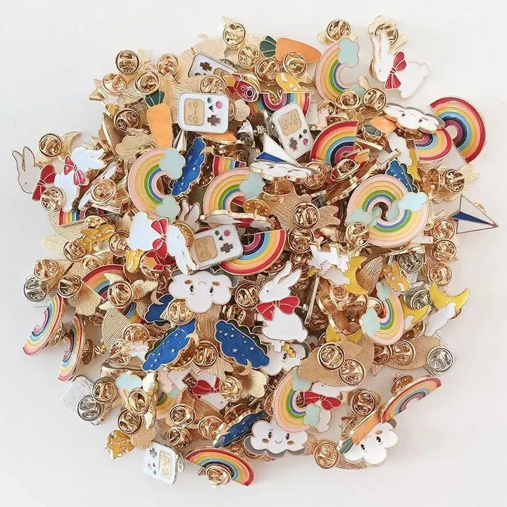Collection of colorful enamel pins with various designs on a white background