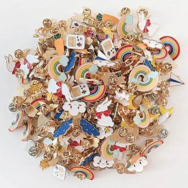 Collection of colorful enamel pins with various designs on a white background