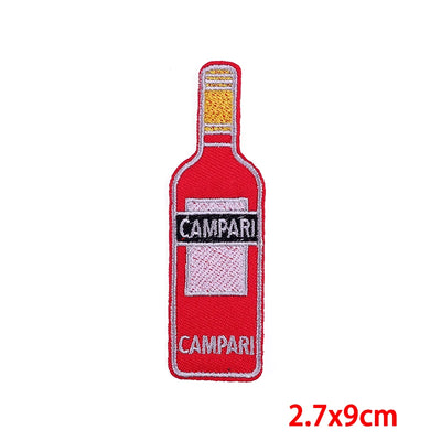 Embroidered patch of a Campari bottle on a white background