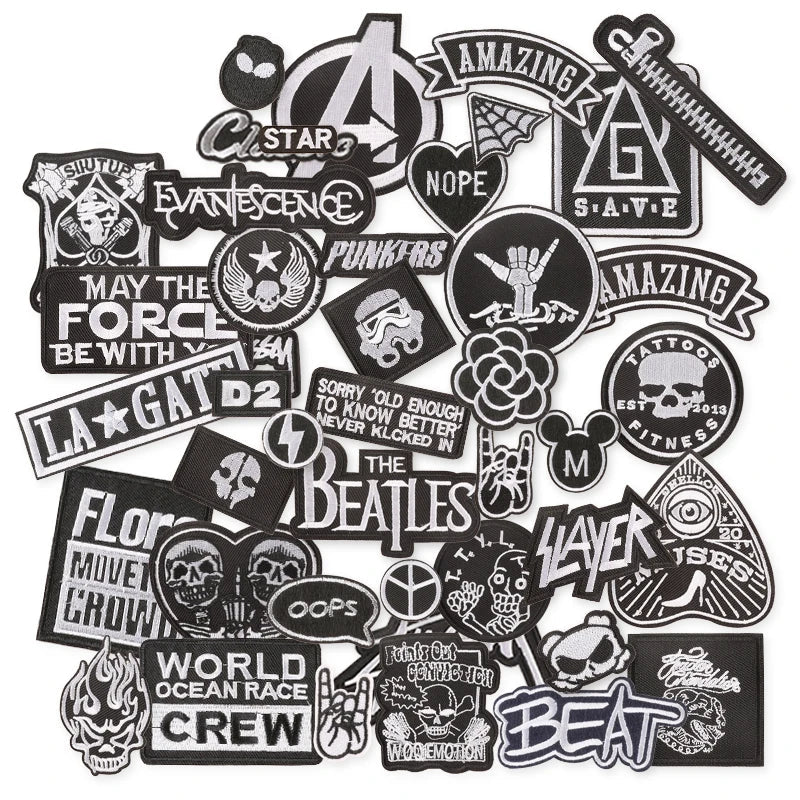 Collection of various black and white stickers with different designs on a white background