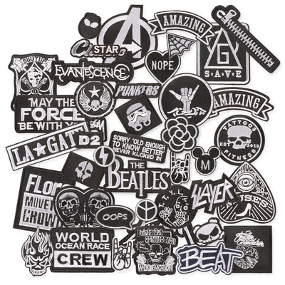 Collection of various black and white stickers with different designs on a white background