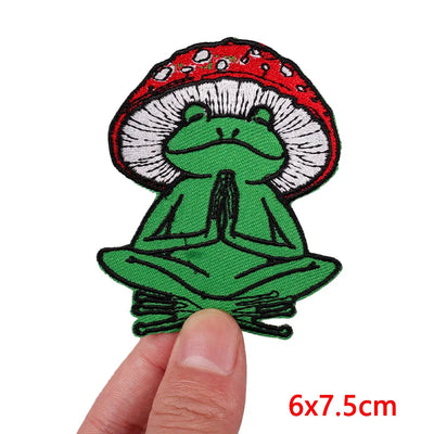 Meditating frog patch on a white background