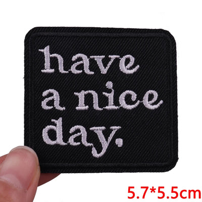 Black patch with 'have a nice day' text held by a hand, size 5.7*5.5cm