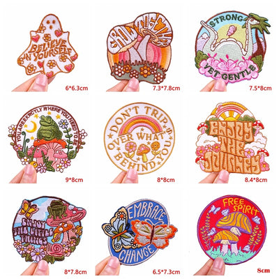 Collection of colorful embroidered patches with various designs and text.