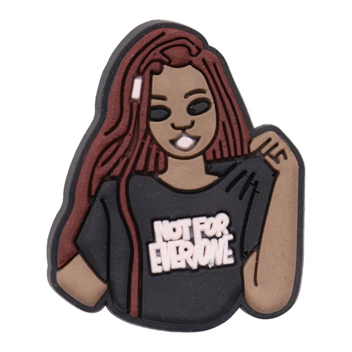 charm of a person with red hair wearing a black shirt with &