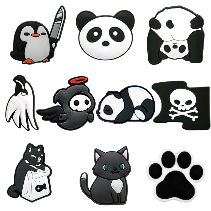 Collection of black and white animal-themed shoe charms on a white background