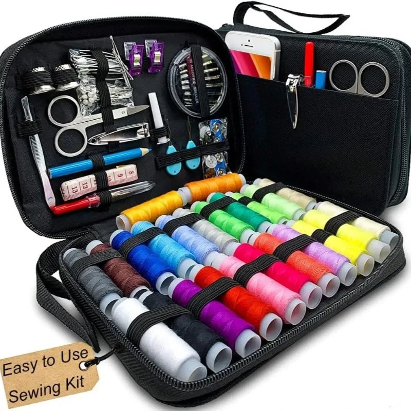 Portable sewing kit case with colorful thread spools needles scissors and repair tools