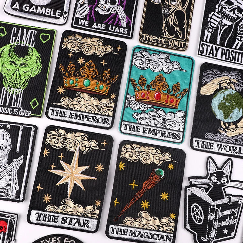 Collection of tarot card-themed patches with various designs on a white background.