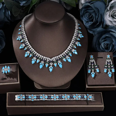 Jewelry set with necklace, earrings, ring and bracelet on a brown display stands with flowers.