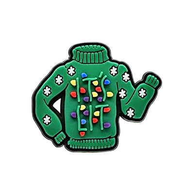 Shoe charm ornament of Green sweater with colorful lights and white flowers on a white background